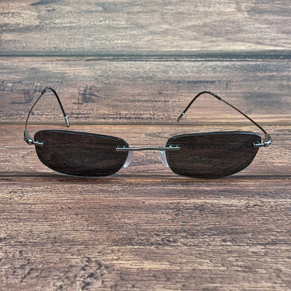 Silhouette 7554 60 6057 Sunglass 
Gunmetal Rimless Rectangular 60-19 FRAMES ONLY